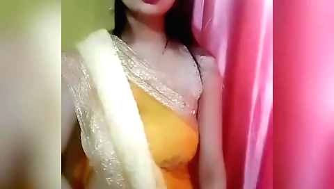 Sexy amateur brunette in indian clothes in front of webcam