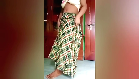A sexy Indian babe is dancing in front of the camera