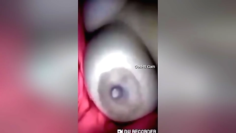 Busty brunette with natural tits showing off her tits in webcam