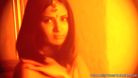 Indian woman with a sexy body is alone in her bedroom