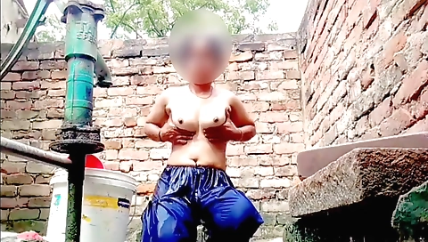 Stunning brunette babe in a red bikini in solo outdoor