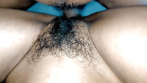 Indian girl with a hairy pussy is fucked by a guy in her room