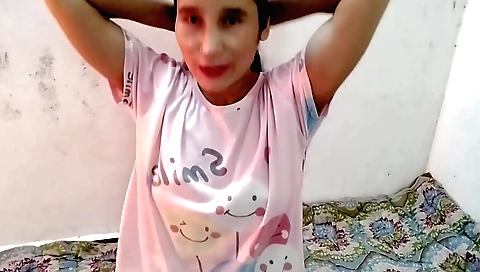 Girl in a dress and a black blouse plays a game with fingers