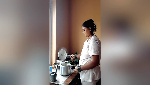 Indian amateur porn video showing a mature woman with big tits