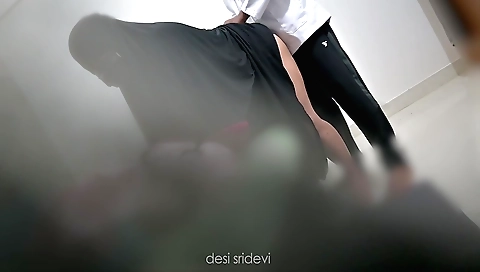 Indian doctor with a pink top and red bikini is making a video