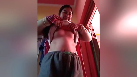 Amateur brunette in a sexy outfit shows off her body