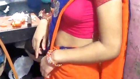 Hot brunette cooking in the kitchen for a amateur video