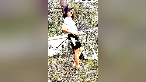 Female in a park talks while her camera is recording