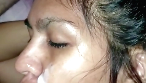 She is giving a blowjob and sucking a dick in her pussy