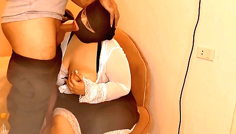 Indian teen in a black dress gives a blowjob to a big cock