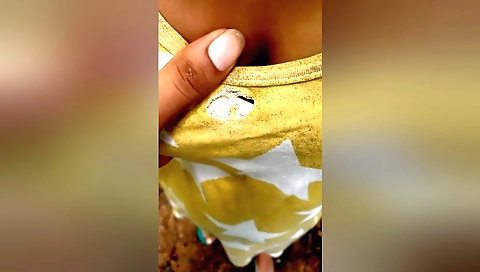 Indian girl riding a motorcycle in the beach outdoors