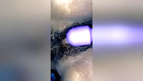 Indian woman masturbates with a toy in her hairy body